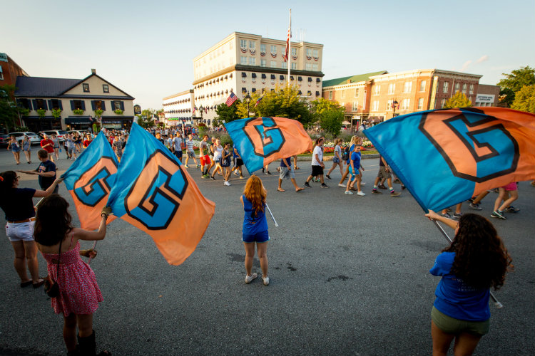 Students pass through the town square during the First-Year Walk.
